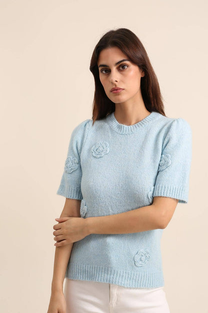 Gebreide trui met bloemen