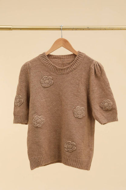 Gebreide trui met bloemen